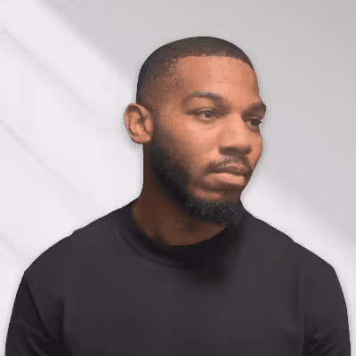 Portrait of a man with a beard wearing a black shirt.
